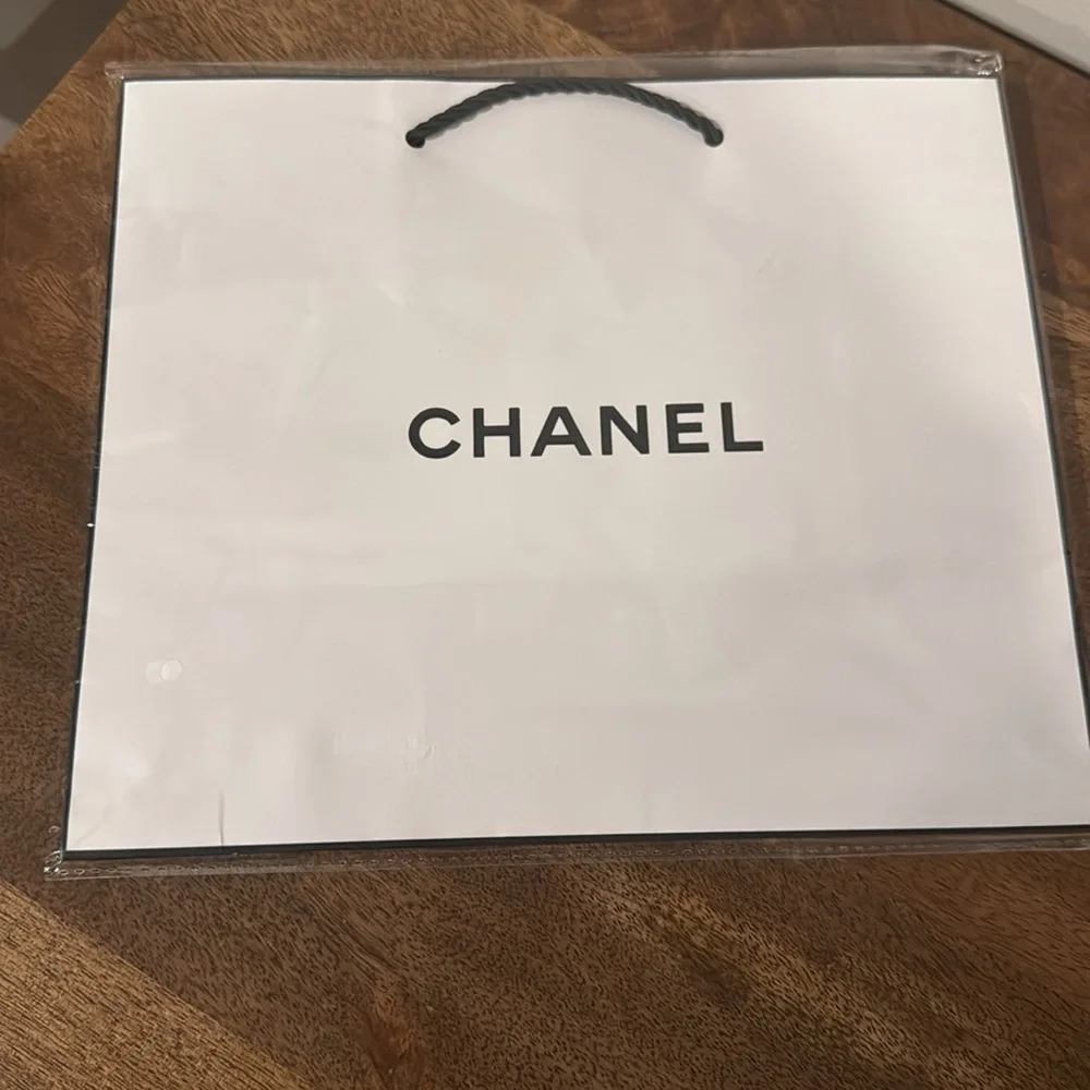 Authentic CHANEL gift bag. 10.5 x 9 x 4.5 in. White with logo in black